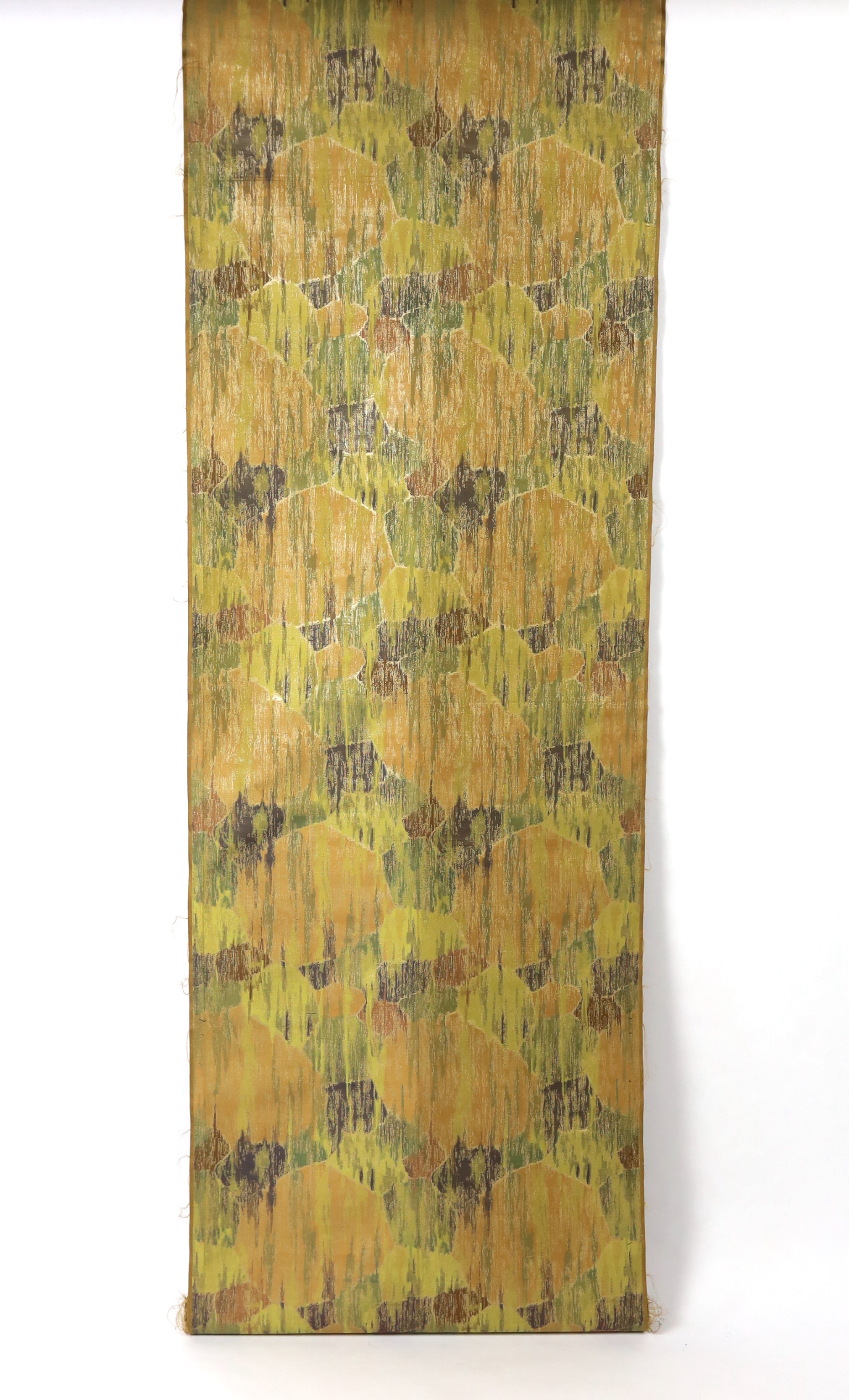 A 1930’s Japanese Kyoto, possibly Nishijin and a Tsumugi hand loomed brocade, woven in fine gold and multi coloured threads, in an abstracted mountainous landscape pattern, originally possibly woven for an Obi, 69cm wide